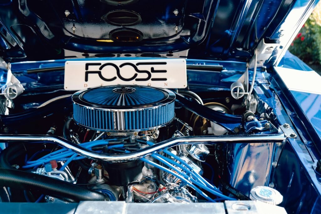 Technician inspecting a car engine during an engine replacement in Fort Lauderdale