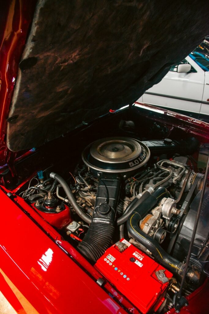 Open engine bay on a car in for European auto repair in Fort Lauderdale, FL