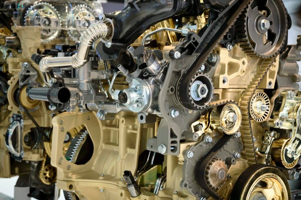 Close-up of a car engine's belt-driven front end, the area opened up for timing belt replacement in Weston, FL